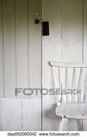 Chair by door View Large Photo Image Stock Image - Chair by door. Fotosearch