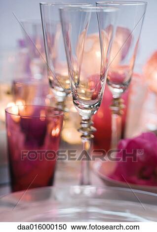 Stock Image - Champagne glasses on set table. Fotosearch
