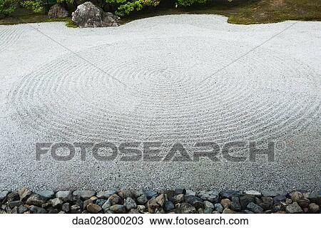 Stock Image - Circular patterns in ornamental rock garden, close-up. Fotosearch