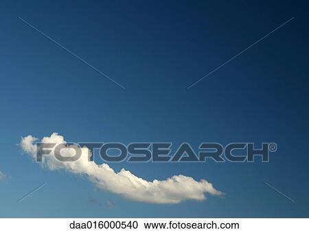 Stock Image - Cloud in blue sky. Fotosearch