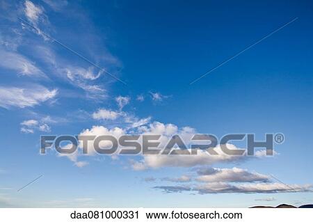 Clouds in blue sky View Large Photo Image Stock Image - Clouds in blue sky. Fotosearch