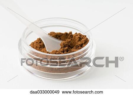 Cocoa powder in small container View Large Photo Image Stock Photo - Cocoa powder in small container. Fotosearch