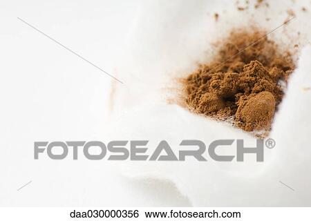 Cocoa powder on cotton cosmetic pad, close-up View Large Photo Image Stock Photograph - Cocoa powder on cotton cosmetic pad, close-up. Fotosearch
