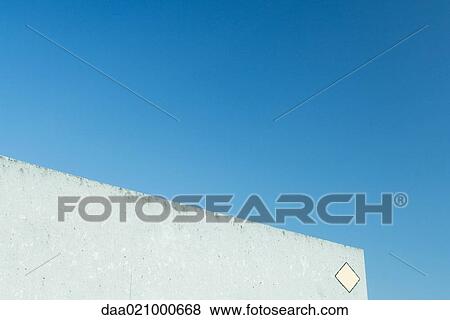 Concrete building with marker on corner, partial view View Large Photo Image Stock Photo - Concrete building with marker on corner, partial view. Fotosearch