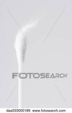 Stock Photo - Cotton swab with end undone into wisps, close-up. Fotosearch