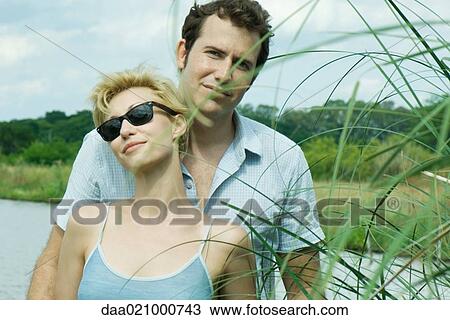 Couple by lake, portrait View Large Photo Image Stock Image - Couple by lake, portrait. Fotosearch