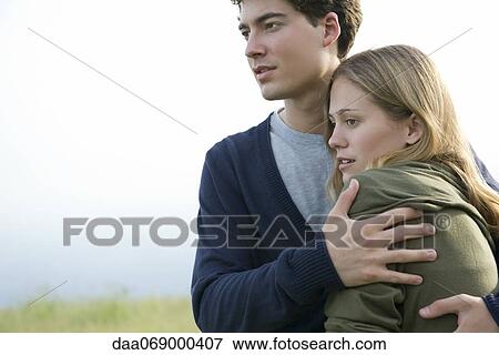 Couple embracing in nature View Large Photo Image Stock Photo - Couple embracing in nature. Fotosearch