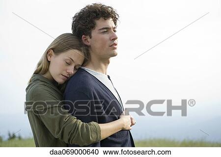 Couple embracing outdoors View Large Photo Image Stock Image - Couple embracing outdoors. Fotosearch