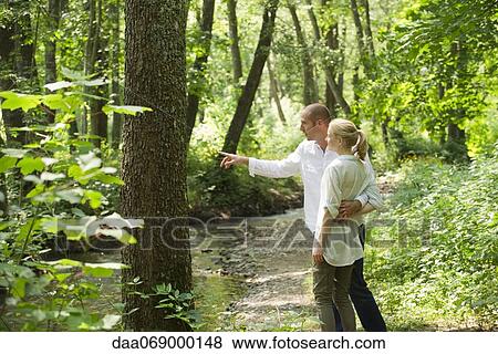 Couple in woods View Large Photo Image Stock Photo - Couple in woods. Fotosearch