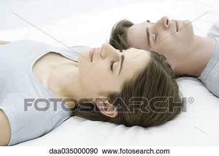 Couple sleeping, heads side by side View Large Photo Image Stock Image - Couple sleeping, heads side by side. Fotosearch