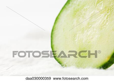 Cucumber slice, close-up View Large Photo Image Stock Photo - Cucumber slice, close-up. Fotosearch