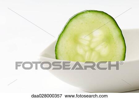 Cucumber slice in small dish View Large Photo Image Stock Photo - Cucumber slice in small dish. Fotosearch