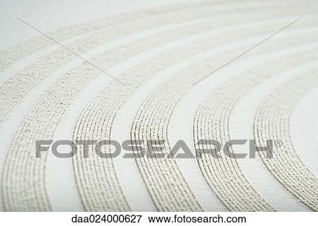Curve pattern traced in sand, close-up View Large Photo Image Stock Photo - Curve pattern traced in sand, close-up. Fotosearch