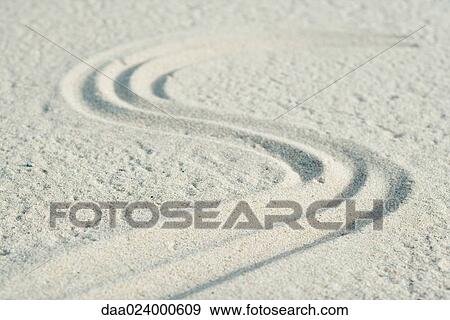 Curve pattern traced into sand View Large Photo Image Stock Photo - Curve pattern traced into sand. Fotosearch