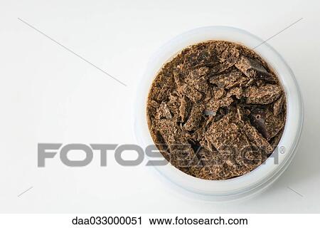Dark chocolate in small container, close-up View Large Photo Image Stock Image - Dark chocolate in small container, close-up. Fotosearch