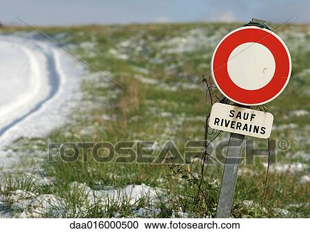 Do not enter sign next to country road View Large Photo Image Stock Image - Do not enter sign next to country road. Fotosearch