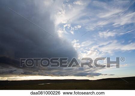Dramatic clouds over barren landscape, Sprengisandur region, Iceland View Large Photo Image Stock Photograph - Dramatic clouds over barren landscape, Sprengisandur region, Iceland. Fotosearch