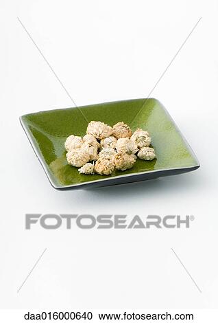 Dried chamomile flowers in dish View Large Photo Image Stock Image - Dried chamomile flowers in dish. Fotosearch