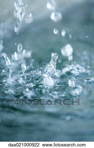 Drops of water hitting surface of water View Large Photo Image Stock Image - Drops of water hitting surface of water. Fotosearch