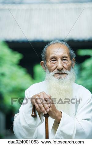 Elderly man wearing traditional Chinese clothing, holding cane View Large Photo Image Stock Image - Elderly man wearing traditional Chinese clothing, holding cane. Fotosearch