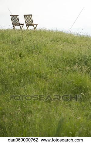Empty chairs on top of hill View Large Photo Image Stock Image - Empty chairs on top of hill. Fotosearch