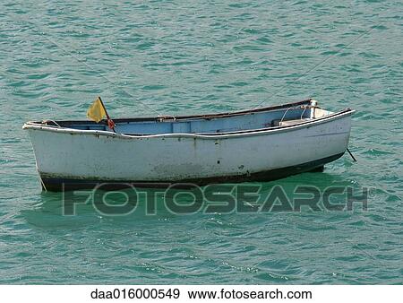 Empty rowboat in water View Large Photo Image Stock Photo - Empty rowboat in water. Fotosearch