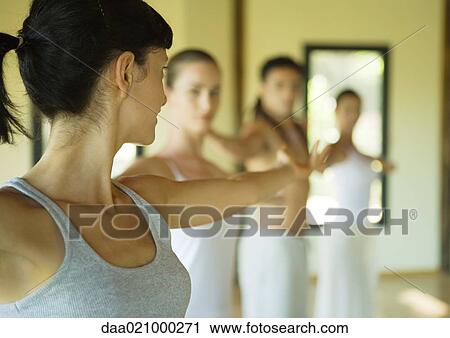 Exercise class stretching arms out View Large Photo Image Stock Image - Exercise class stretching arms out. Fotosearch