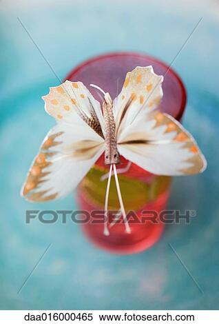Fake butterfly on edge of glass View Large Photo Image Stock Photography - Fake butterfly on edge of glass. Fotosearch