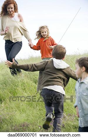 Family having fun outdoors View Large Photo Image Stock Image - Family having fun outdoors. Fotosearch
