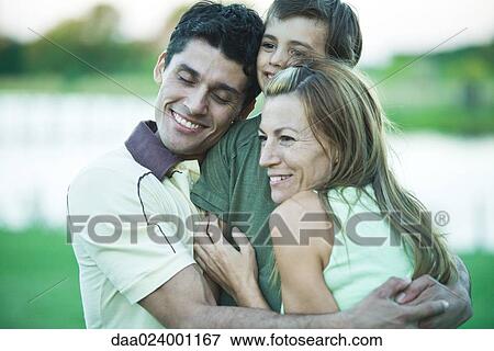 Family having group hug View Large Photo Image Stock Photo - Family having group hug. Fotosearch
