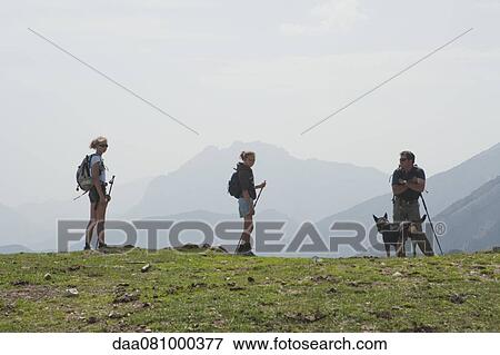 Stock Photo - Family hiking on mountain. Fotosearch