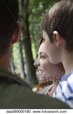 Family in nature, focus on young woman View Large Photo Image Stock Image - Family in nature, focus on young woman. Fotosearch