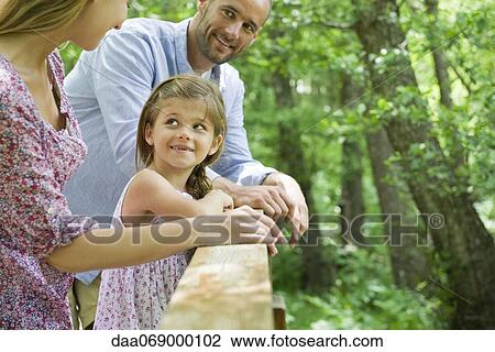 Stock Image - Family spending time together outdoors. Fotosearch