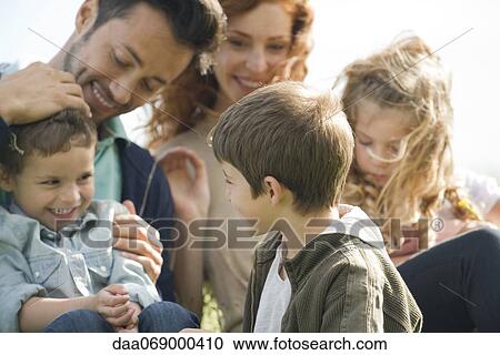 Stock Image - Family spending time together outdoors. Fotosearch