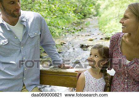 Stock Image - Family spending time together outdoors. Fotosearch