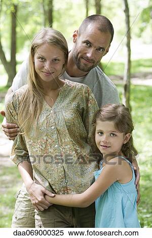 Family together outdoors, portrait View Large Photo Image Stock Photography - Family together outdoors, portrait. Fotosearch