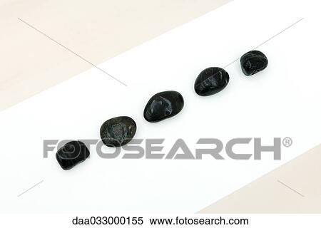 Five stones in a row, high angle view View Large Photo Image Stock Photography - Five stones in a row, high angle view. Fotosearch