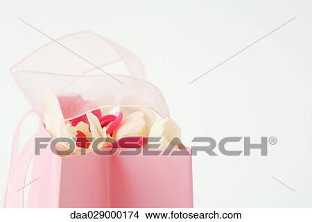 Flower petals in gift bag, close-up View Large Photo Image Picture - Flower petals in gift bag, close-up. Fotosearch