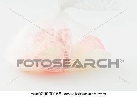 Flower petals in mesh bag, close-up View Large Photo Image Stock Photography - Flower petals in mesh bag, close-up. Fotosearch