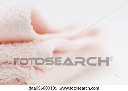 Folded pink blanket, close-up View Large Photo Image Stock Photography - Folded pink blanket, close-up. Fotosearch