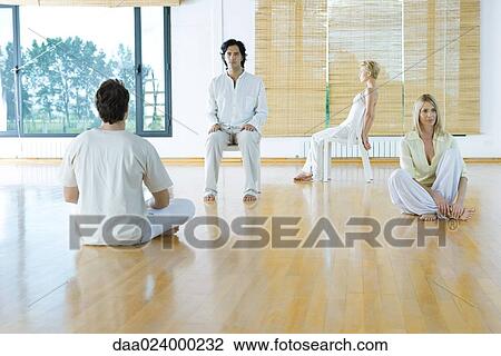 Four adults in various postures in wellness center View Large Photo Image Stock Image - Four adults in various postures in wellness center. Fotosearch