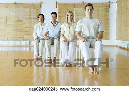 Four adults sitting in chairs in wellness center, facing camera View Large Photo Image Stock Photography - Four adults sitting in chairs in wellness center, facing camera. Fotosearch