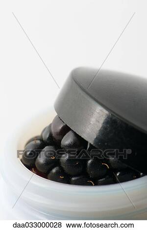 Fresh blackberry in small half-open cosmetic container View Large Photo Image Stock Photo - Fresh blackberry in small half-open cosmetic container. Fotosearch