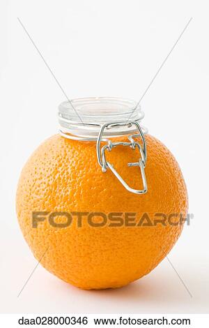 Fresh orange with canning lid on top of it View Large Photo Image Stock Photograph - Fresh orange with canning lid on top of it. Fotosearch