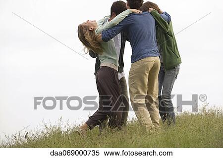 Stock Photography - Friends gathering around in circle. Fotosearch
