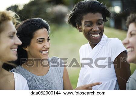Picture - Friends together outdoors. Fotosearch