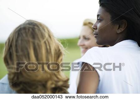 Friends together outdoors View Large Photo Image Stock Image - Friends together outdoors. Fotosearch