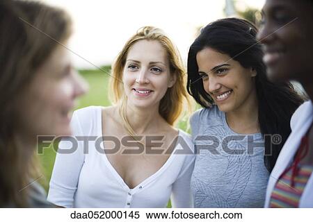 Friends together outdoors View Large Photo Image Stock Photography - Friends together outdoors. Fotosearch