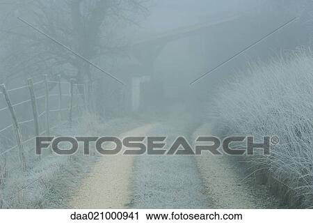 Frost covered landscape with dirt road and fence View Large Photo Image Stock Image - Frost covered landscape with dirt road and fence. Fotosearch