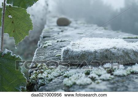 Stock Photograph - Frost covered stone wall. Fotosearch